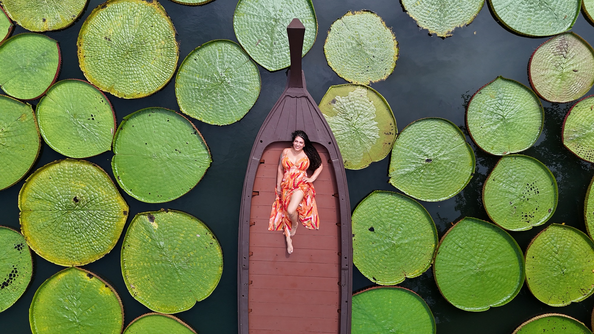 Jossy doing aerial photoshoot on giant lilypads